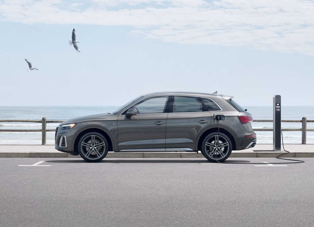 Side view of Audi SUV parked at the beach